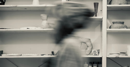 pottery and ceramic studio visual shot in front of the shelves